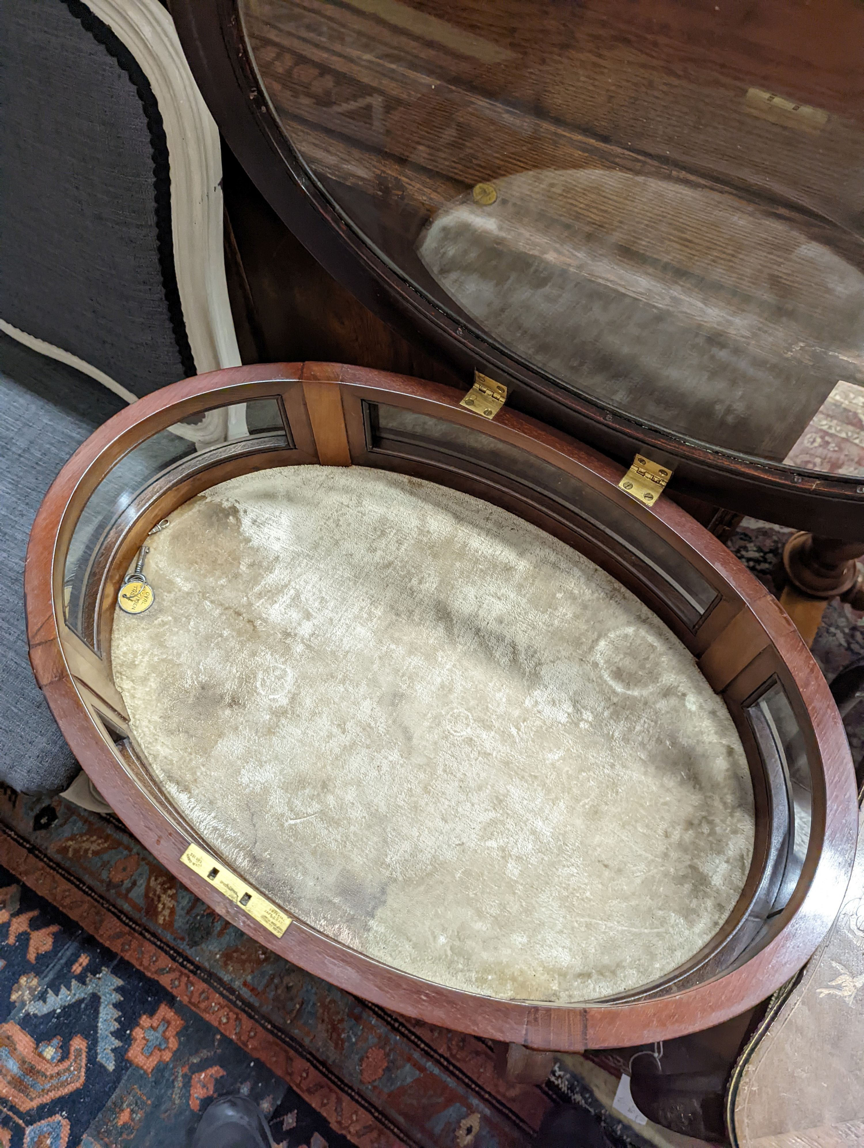 An oval marquetry inlaid mahogany bijouterie table, together with a larger rectangular bijouterie table, larger width 64cm, depth 46cm, height 72cm